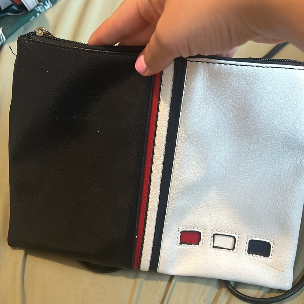 A small over shoulder bag .